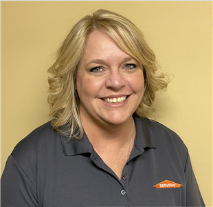 smiling woman in a SERVPRO polo